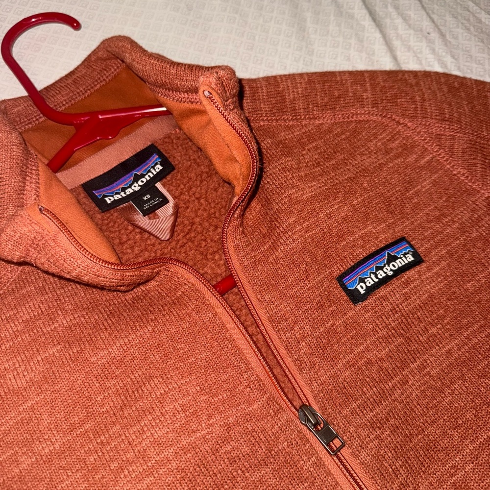 Patagonia Rusty Orange Fleece Jacket with Stand-Up Collar and Zipper Closure